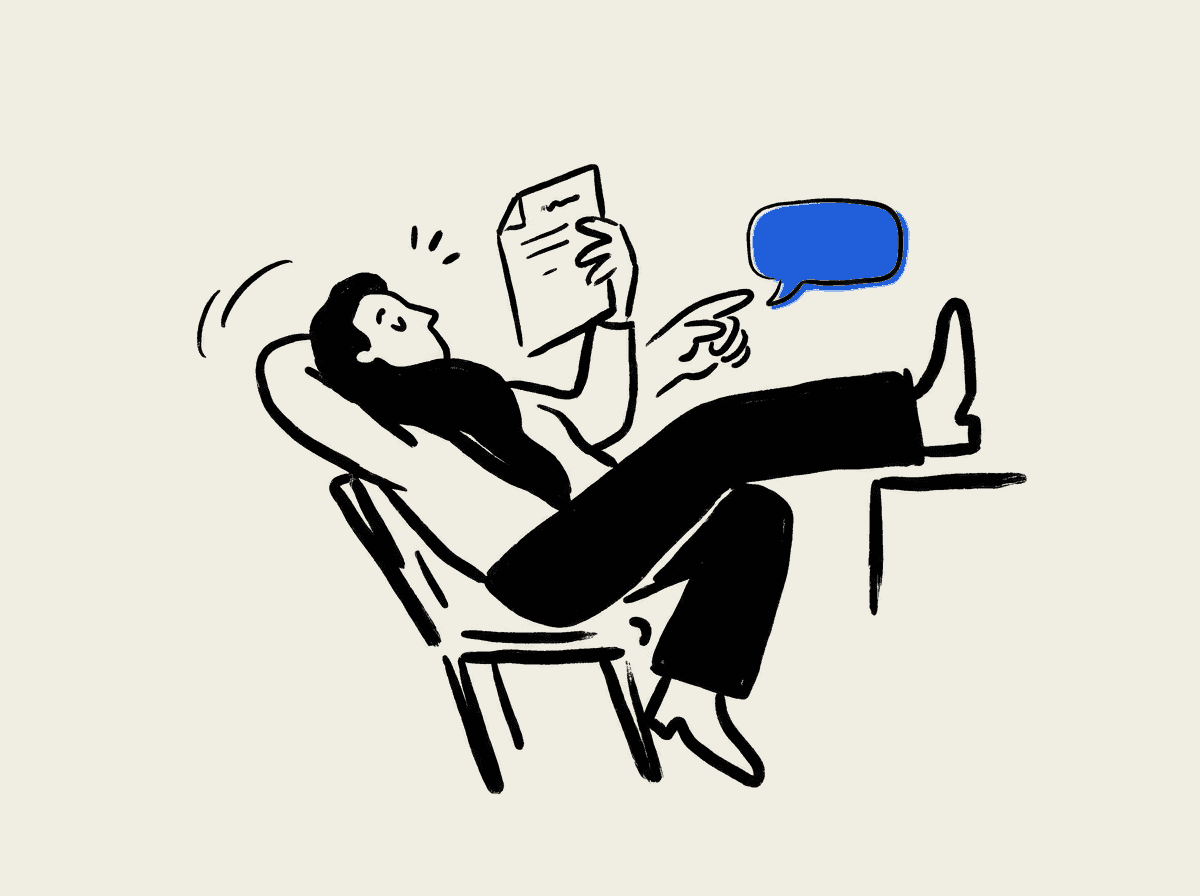 An underwriter leans back in a chair, reading a document and tapping a speech bubble.